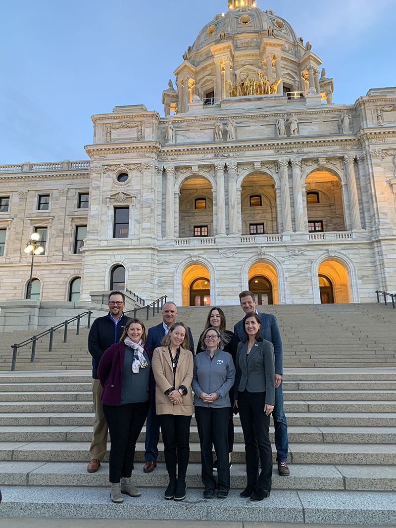 commissioners on state capitol steps