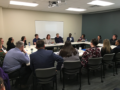 Participants at community engagement session, roundtable-setting