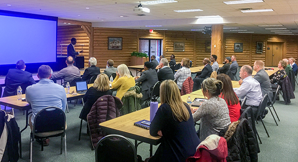 DEED Deputy Commissioner Hanse Warfa and St. Cloud business meeting